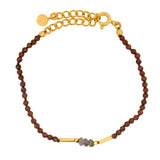 Gold rod bracelet and natural stones