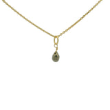 Golden necklace with small faceted natural stone