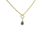 Golden necklace with small faceted natural stone