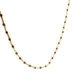 Gold necklace with tubes and stones