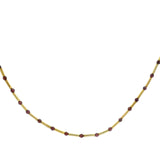 Gold necklace with tubes and stones