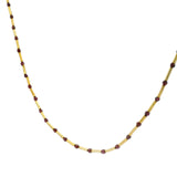 Gold necklace with tubes and stones