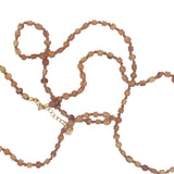 Collier doré perles beiges en corne avec noeuds beiges 75 cm
