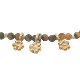 Bracelet with guilloche stones and flower tassels