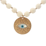 Collier doré médaillon avec oeil en nacre perles en os 90 cm