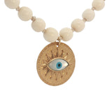 Collier doré médaillon avec oeil en nacre perles en os 90 cm