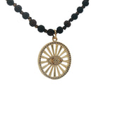 Collier médaillon doré oeil en zircons perles en bois marron 90 cm