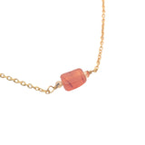 Golden necklace with rectangular stone and small faceted stones