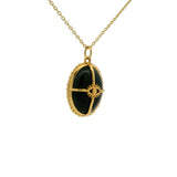 Gold necklace with cabochon stone, gold cage and eye