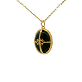 Gold necklace with cabochon stone, gold cage and eye