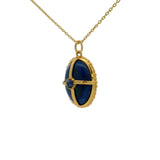 Collier doré pierre lapis cabochon et cage dorée
