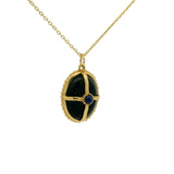 Collier doré onyx noir et lapis cabochon et cage dorée