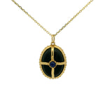 Collier doré onyx noir et lapis cabochon et cage dorée
