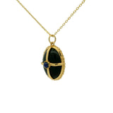 Collier doré onyx noir et lapis cabochon et cage dorée