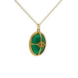 Gold necklace with cabochon stone, gold cage and eye