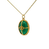 Gold necklace with cabochon stone, gold cage and eye