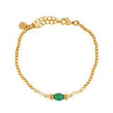 Bracelet with golden balls, stones and discs