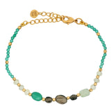 Golden bracelet with stones and small balls