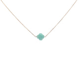 Gold clover necklace with faceted stone