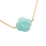 Gold clover necklace with faceted stone