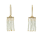 Golden earrings with a cascade of stones and zircons