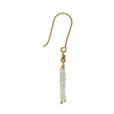 Golden earrings with a cascade of stones and zircons