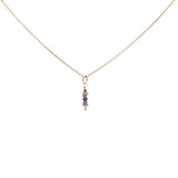 Golden necklace with stone pendant and golden balls