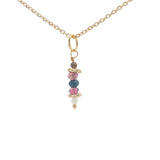 Golden necklace with stone pendant and golden balls