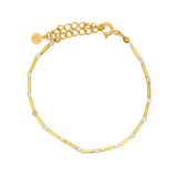 Golden bracelet with rods and natural stones