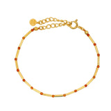 Bracelet doré pierre de lune orange alternée avec des tubes dorés