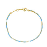 Bracelet doré Tennis en zircons blancs et bleus