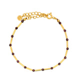 Bracelet doré grenat alterné avec des tubes dorés