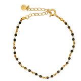 Golden bracelet with stones and golden discs