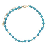 Chaine de cheville dorée en perles turquoise, disques dorés et noeuds turquoise