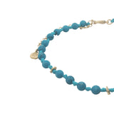 Chaine de cheville dorée en perles turquoise, disques dorés et noeuds turquoise