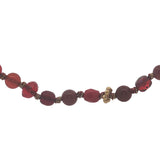 Collier doré perles rouges, en bois, couronnes dorées et noeuds rouges 64 cm