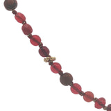 Collier doré perles rouges, en bois, couronnes dorées et noeuds rouges 64 cm