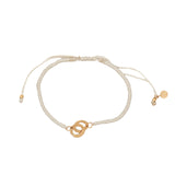 Bracelet cordon crème menottes dorées