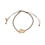 Bracelet cordon beige menottes dorées