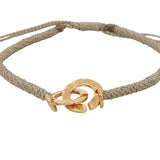 Bracelet cordon beige menottes dorées