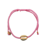 Bracelet sur cordon rose avec cauri doré