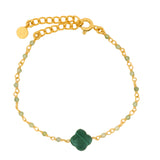 Golden clover bracelet with faceted stone