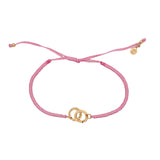 Bracelet cordon rose menottes dorées
