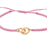 Bracelet cordon rose menottes dorées