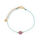 Bracelet doré cordon turquoise avec oeil rond rouge