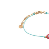 Bracelet doré cordon turquoise avec oeil rond rouge