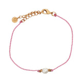 Pink cord chain bracelet and talismans