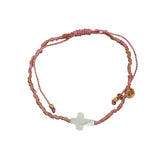 Rose gold cord bracelet and mother-of-pearl cross