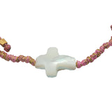 Rose gold cord bracelet and mother-of-pearl cross