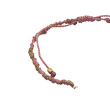 Rose gold cord bracelet and mother-of-pearl cross